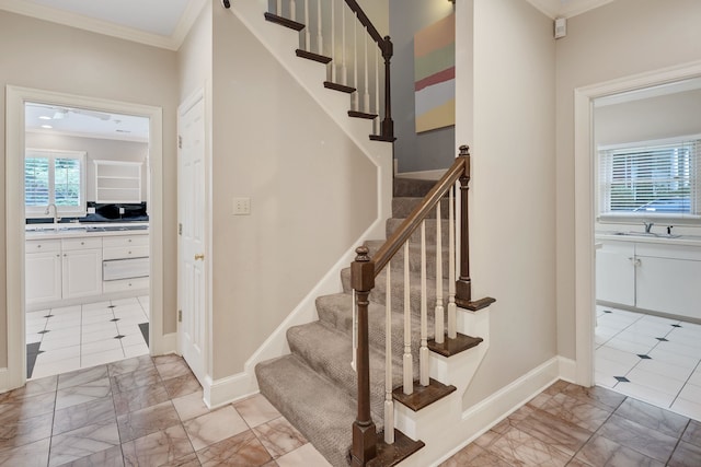415 S Yates Cv, Memphis, TN 38120 - staircase featuring ornamental molding, marble finish floors, and baseboards