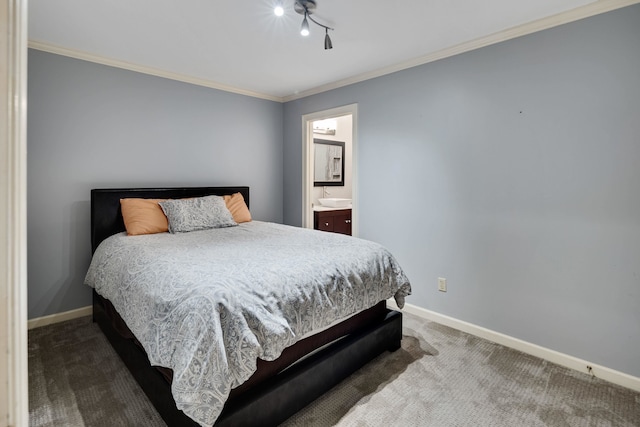 415 S Yates Cv, Memphis, TN 38120 - bedroom featuring carpet, baseboards, crown molding, and ensuite bath