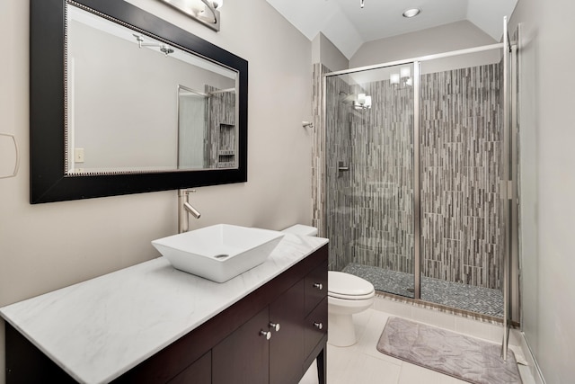 415 S Yates Cv, Memphis, TN 38120 - full bathroom featuring toilet, vanity, a stall shower, lofted ceiling, and tile patterned floors