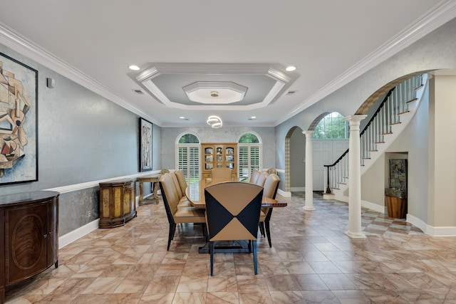 415 S Yates Cv, Memphis, TN 38120 - dining space with arched walkways, ornate columns, crown molding, stairway, and recessed lighting