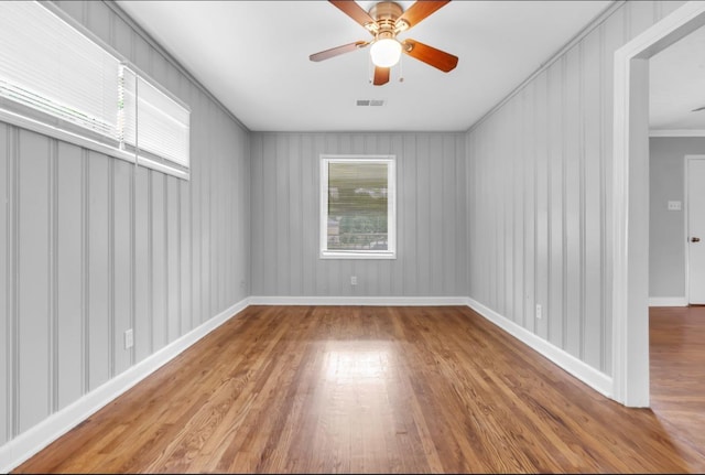 1078 E Walthal Cir, Memphis, TN 38111 - spare room featuring wood finished floors, a ceiling fan, ornamental molding, and baseboards