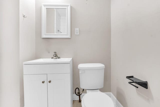1148 Rozelle St, Memphis, TN 38106 - bathroom featuring toilet, vanity, and baseboards