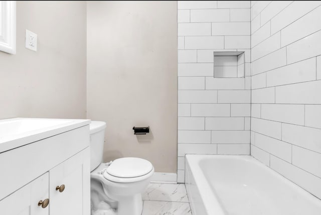 1148 Rozelle St, Memphis, TN 38106 - full bath featuring marble finish flooring, a tub to relax in, toilet, baseboards, and vanity