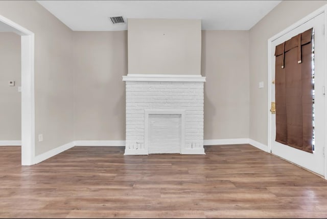 1148 Rozelle St, Memphis, TN 38106 - unfurnished living room featuring wood finished floors and baseboards