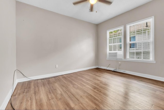 1148 Rozelle St, Memphis, TN 38106 - empty room with baseboards, wood finished floors, and ceiling fan