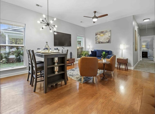 839 Woodlawn St, Memphis, TN 38107 - living area with attic access, wood finished floors, baseboards, and ceiling fan