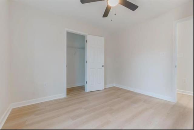4100 New Willow Rd, Memphis, TN 38111 - unfurnished bedroom with light wood-style floors, baseboards, and a spacious closet