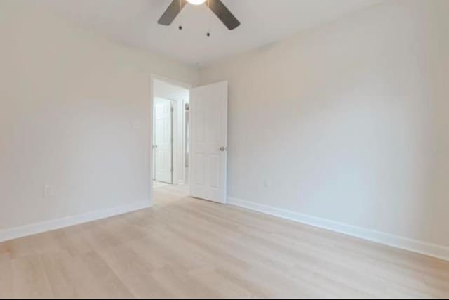 4100 New Willow Rd, Memphis, TN 38111 - unfurnished room with light wood finished floors, ceiling fan, and baseboards