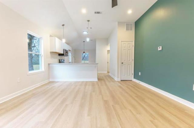 4100 New Willow Rd, Memphis, TN 38111 - unfurnished living room featuring vaulted ceiling, light wood-style floors, baseboards, and ceiling fan