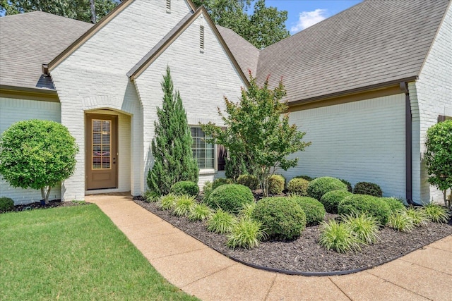 4510 Windway Cv, Bartlett, TN 38135 - view of side of property featuring brick siding, a shingled roof, and a lawn