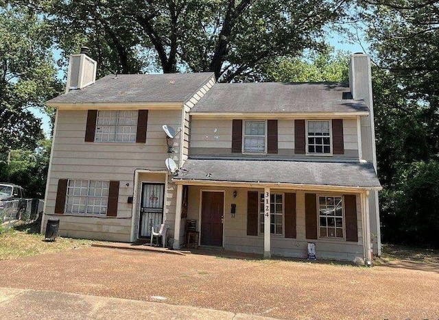 3122-3124 Monterrey Sq, Memphis, TN 38111 - townhome / multi-family property featuring a chimney and covered porch