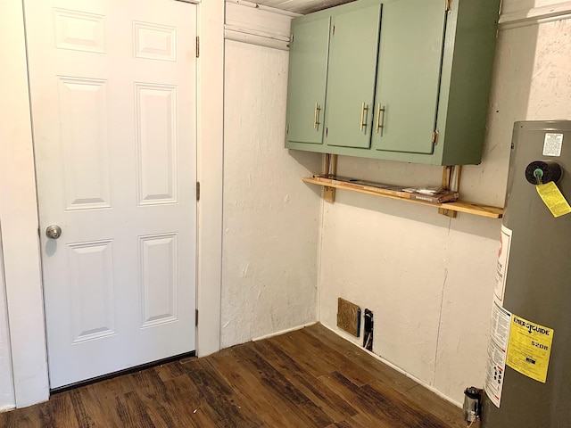 119 Red Bird Rd, Middleton, TN 38052 - laundry area with gas water heater, dark wood-style flooring, and cabinet space