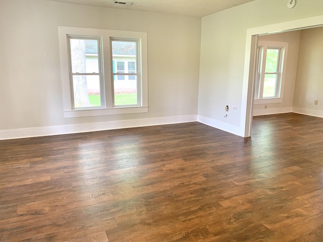 119 Red Bird Rd, Middleton, TN 38052 - unfurnished room featuring plenty of natural light, dark wood finished floors, and baseboards