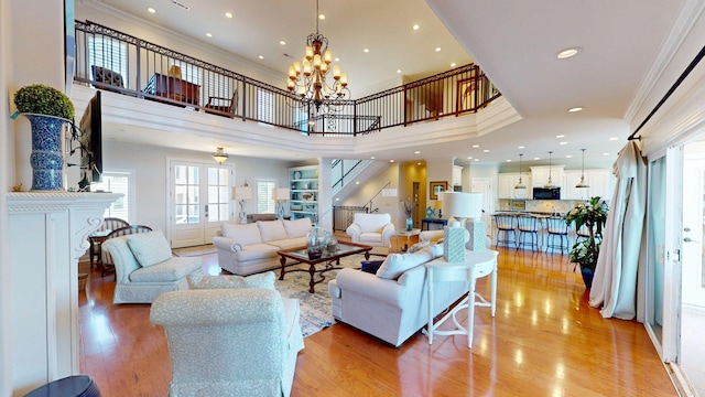 410 Shipwatch Pt, Savannah, TN 38372 - living area featuring ornamental molding, light wood-style floors, a chandelier, and recessed lighting