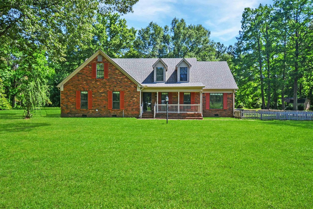 5955 Broad Meadows Dr, Millington, TN 38053 - cape cod house with crawl space, brick siding, a porch, and a shingled roof