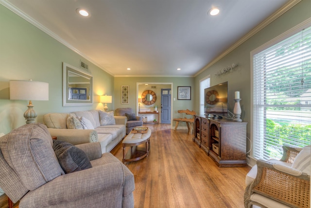 4834 Welchshire Ave, Memphis, TN 38117 - living area featuring healthy amount of natural light, crown molding, wood finished floors, recessed lighting, and baseboards