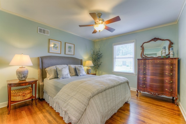 4834 Welchshire Ave, Memphis, TN 38117 - bedroom featuring wood finished floors, crown molding, baseboards, and ceiling fan