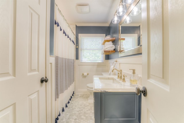 4834 Welchshire Ave, Memphis, TN 38117 - full bathroom with toilet, vanity, crown molding, and a shower with shower curtain
