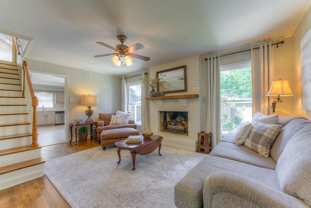 4834 Welchshire Ave, Memphis, TN 38117 - living room with stairway, healthy amount of natural light, and a brick fireplace