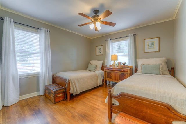 4834 Welchshire Ave, Memphis, TN 38117 - bedroom featuring light wood-style floors, baseboards, ornamental molding, and a ceiling fan