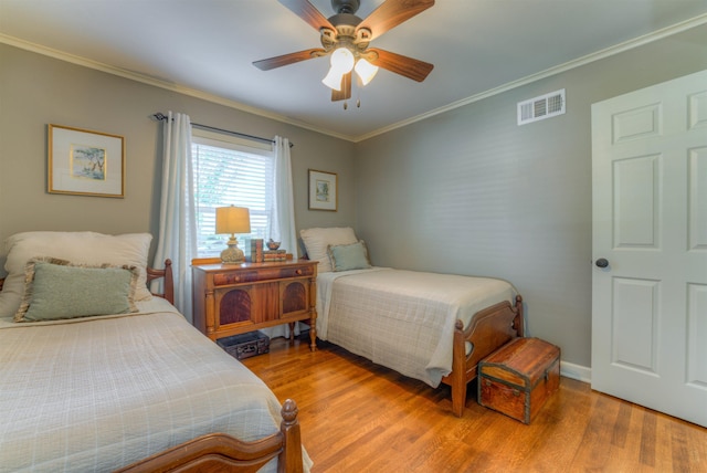 4834 Welchshire Ave, Memphis, TN 38117 - bedroom with wood finished floors, ornamental molding, ceiling fan, and baseboards