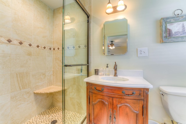 4834 Welchshire Ave, Memphis, TN 38117 - full bathroom featuring a shower stall, vanity, toilet, and ceiling fan