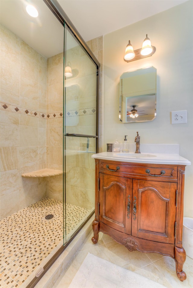 4834 Welchshire Ave, Memphis, TN 38117 - bathroom featuring a stall shower, vanity, tile patterned flooring, and ceiling fan