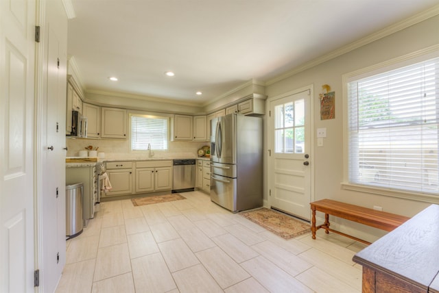 4834 Welchshire Ave, Memphis, TN 38117 - kitchen with appliances with stainless steel finishes, ornamental molding, a sink, tasteful backsplash, and recessed lighting