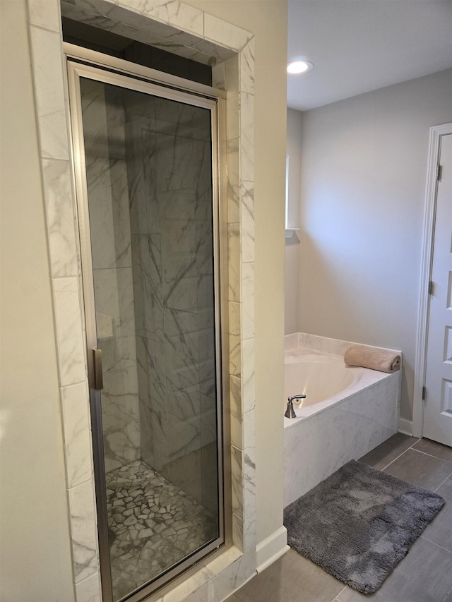 7898 Park Valley Dr, Southaven, MS 38671 - bathroom with a garden tub, a stall shower, and recessed lighting