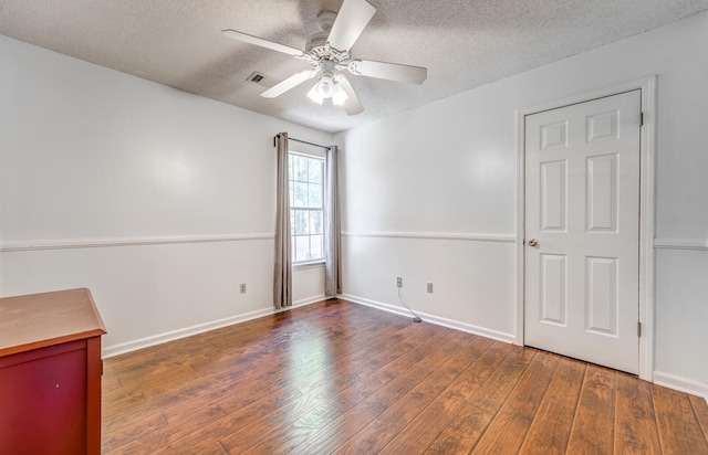 8023 Allbright Cv, Bartlett, TN 38133 - spare room featuring ceiling fan, a textured ceiling, wood finished floors, and baseboards