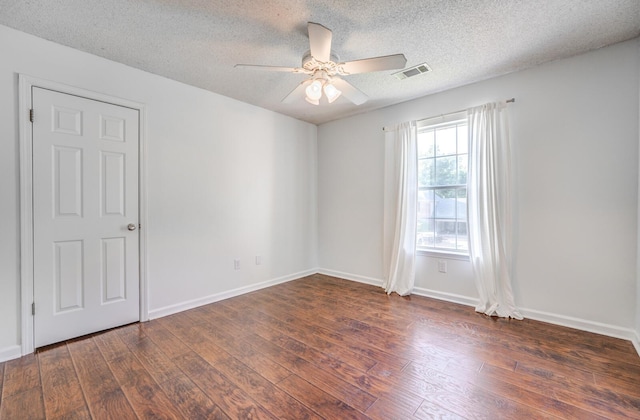 8023 Allbright Cv, Bartlett, TN 38133 - empty room featuring dark wood-style floors, a ceiling fan, a textured ceiling, and baseboards