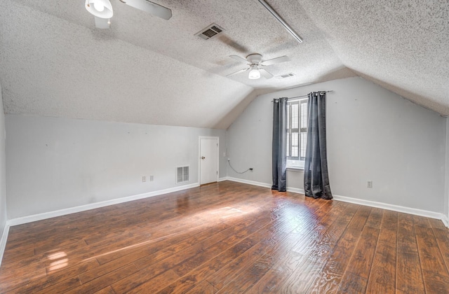 8023 Allbright Cv, Bartlett, TN 38133 - additional living space featuring ceiling fan, a textured ceiling, wood finished floors, lofted ceiling, and baseboards