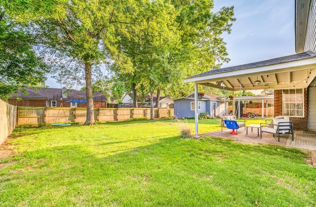 8023 Allbright Cv, Bartlett, TN 38133 - view of yard featuring a patio, an outbuilding, and a residential view