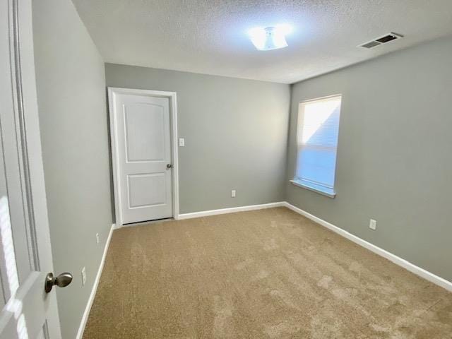 7407 Crayton Ridge Dr, Cordova, TN 38018 - unfurnished room with carpet, baseboards, and a textured ceiling