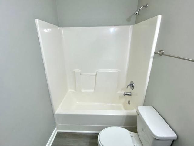 7407 Crayton Ridge Dr, Cordova, TN 38018 - bathroom featuring toilet, shower / washtub combination, and baseboards