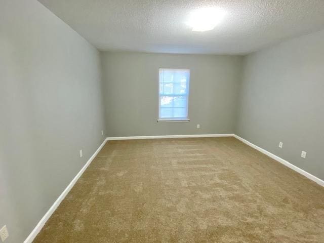 7407 Crayton Ridge Dr, Cordova, TN 38018 - carpeted empty room featuring a textured ceiling and baseboards