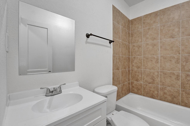 1394 Chadwick Cir, Memphis, TN 38114 - full bathroom with toilet, vanity, washtub / shower combination, and a textured wall