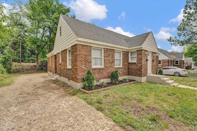 1394 Chadwick Cir, Memphis, TN 38114 - view of home's exterior featuring brick siding and roof with shingles