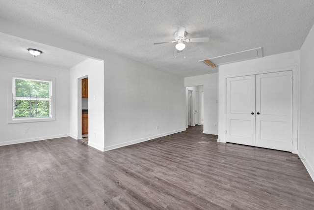 1394 Chadwick Cir, Memphis, TN 38114 - unfurnished living room featuring a ceiling fan, attic access, a textured ceiling, dark wood-style floors, and baseboards