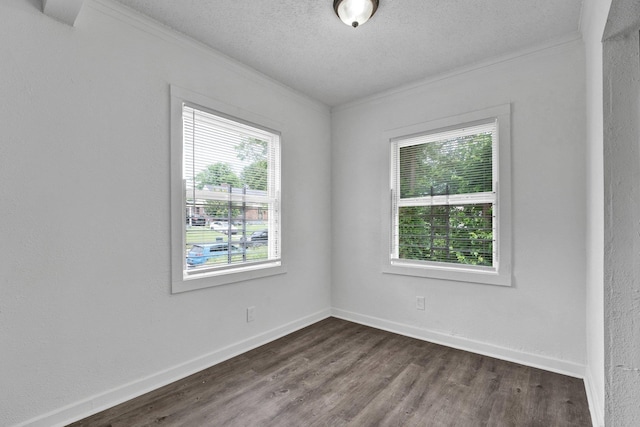1394 Chadwick Cir, Memphis, TN 38114 - empty room featuring ornamental molding, dark wood-style flooring, a textured ceiling, and baseboards