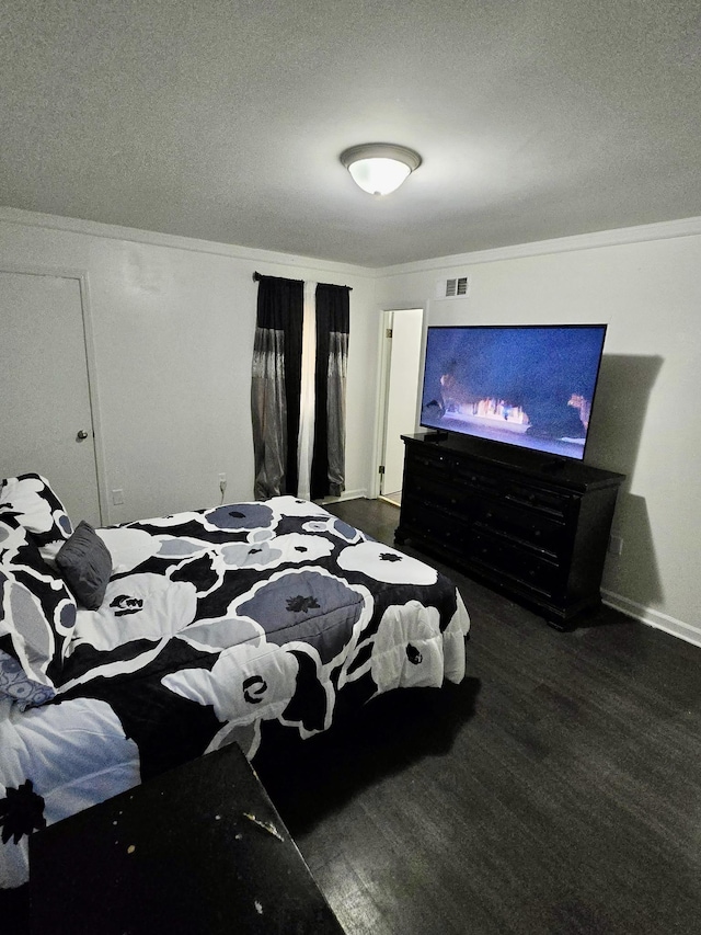 3393 Brownbark Dr, Memphis, TN 38115 - bedroom with a textured ceiling, ornamental molding, and baseboards
