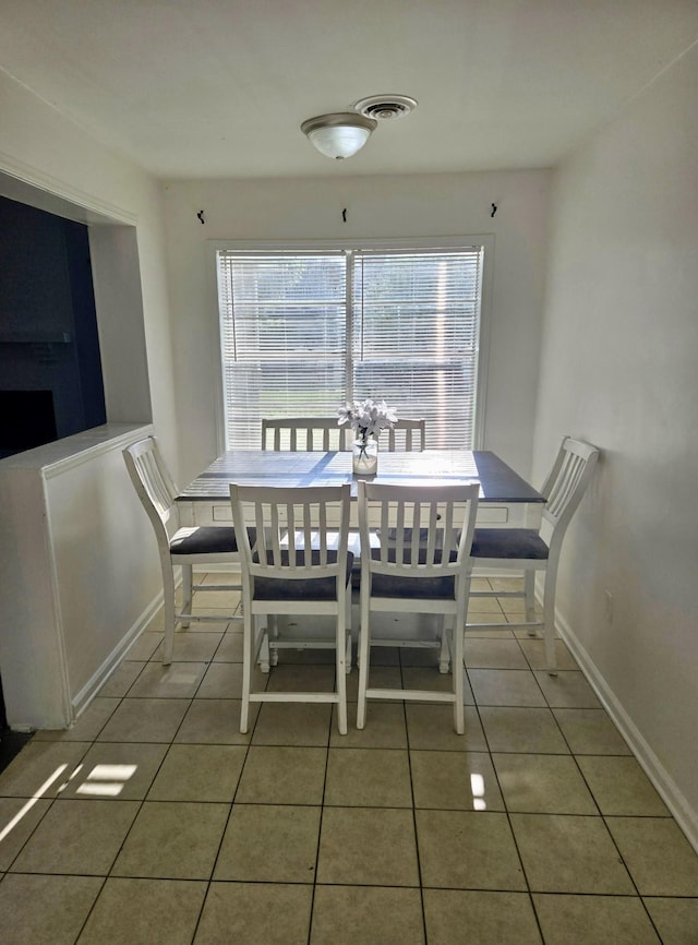 3393 Brownbark Dr, Memphis, TN 38115 - dining room featuring plenty of natural light, tile patterned flooring, and baseboards
