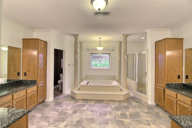 791 Autumn Winds Dr, Collierville, TN 38017 - bathroom with decorative columns, a shower stall, a garden tub, a textured ceiling, and crown molding