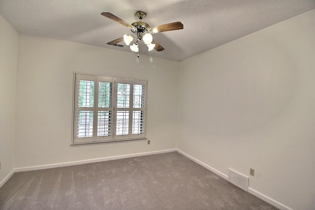 791 Autumn Winds Dr, Collierville, TN 38017 - unfurnished room with a ceiling fan, dark colored carpet, baseboards, and a textured ceiling