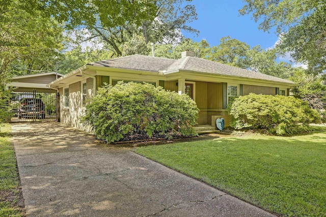 4141 Sequoia Ave, Memphis, TN 38117 - ranch-style home featuring driveway, a front lawn, a chimney, a carport, and roof with shingles