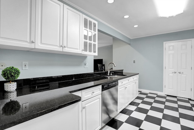 4141 Sequoia Ave, Memphis, TN 38117 - kitchen with stainless steel dishwasher, a sink, dark floors, recessed lighting, and white cabinets