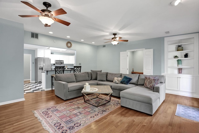 4141 Sequoia Ave, Memphis, TN 38117 - living area with ceiling fan, wood finished floors, built in features, recessed lighting, and baseboards