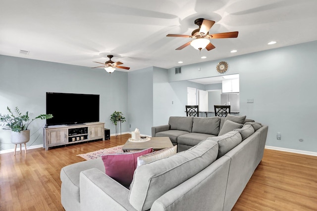 4141 Sequoia Ave, Memphis, TN 38117 - living room featuring ceiling fan, baseboards, light wood finished floors, and recessed lighting