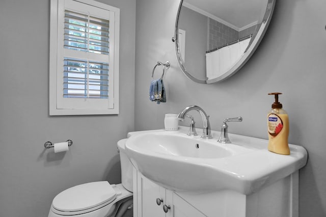 4141 Sequoia Ave, Memphis, TN 38117 - bathroom with toilet, vanity, ornamental molding, and a shower with curtain