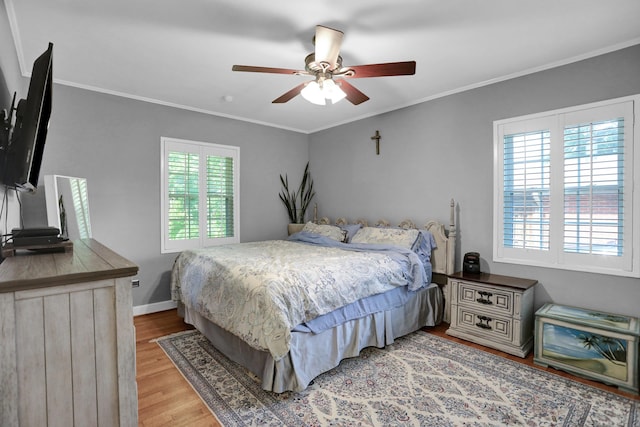 4141 Sequoia Ave, Memphis, TN 38117 - bedroom with light wood-style floors, crown molding, ceiling fan, and baseboards